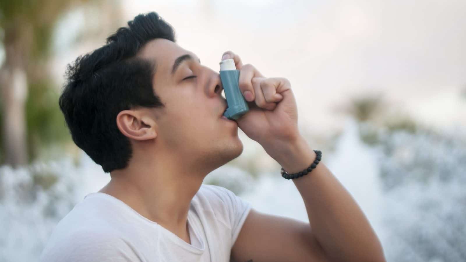Young Man Asthma Inhaler Stock Photo