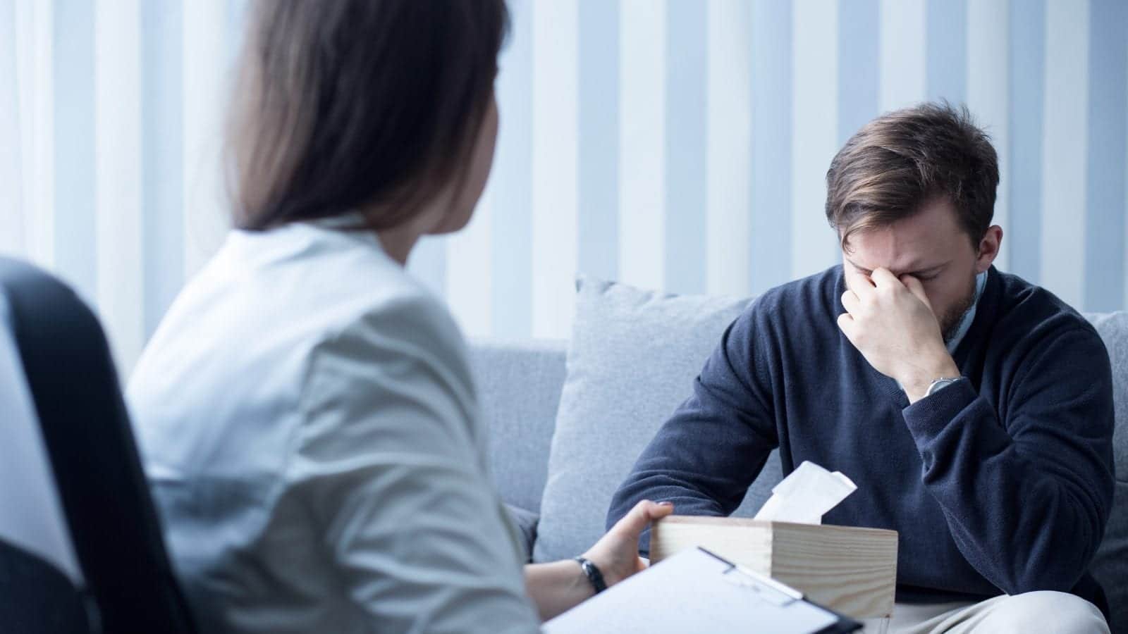 Female Counselor Helping Depressed Man